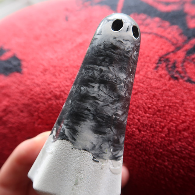 A Gemstone Mason with a dark grey polished upper